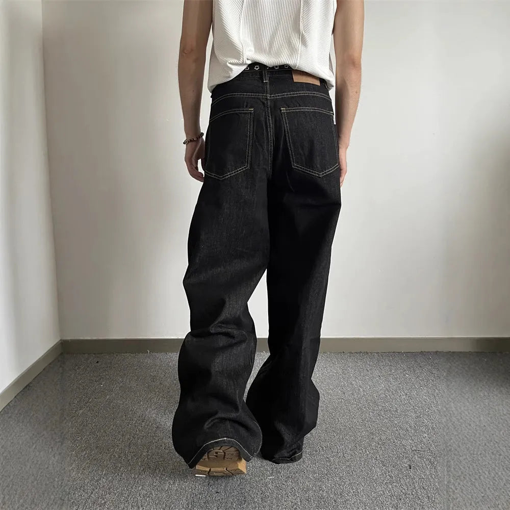 Black retro wide-leg jeans with straight-leg cut and mid waist, featuring zip placket closure