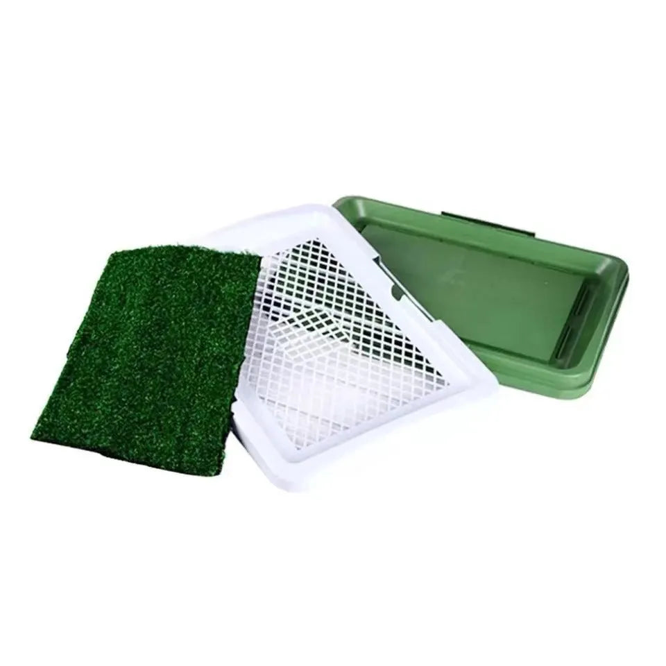 Green artificial grass dog toilet training tray with three-layer construction on a balcony.