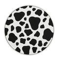 Black and white checkerboard plastic car cup mat placed in a vehicle door slot.