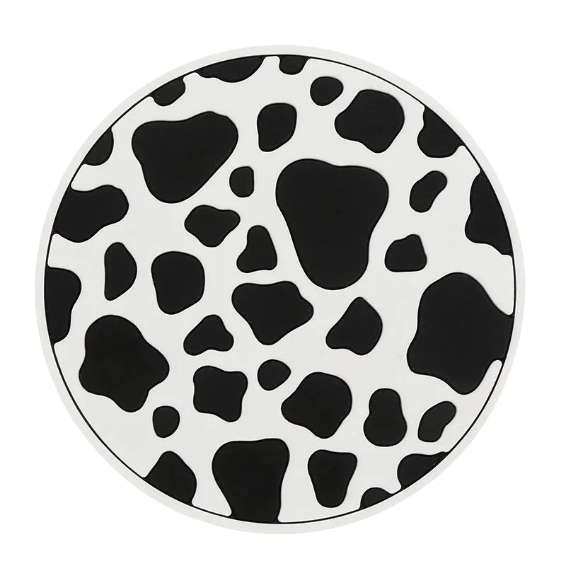 Black and white checkerboard plastic car cup mat placed in a vehicle door slot.