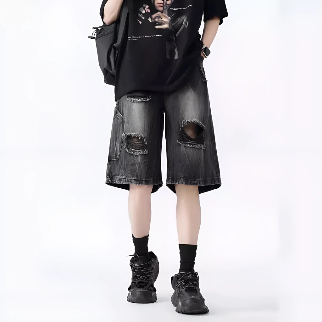 Retro loose-fit ripped denim shorts in washed black or blue with distressed detailing