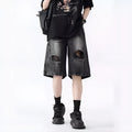 Retro loose-fit ripped denim shorts in washed black or blue with distressed detailing