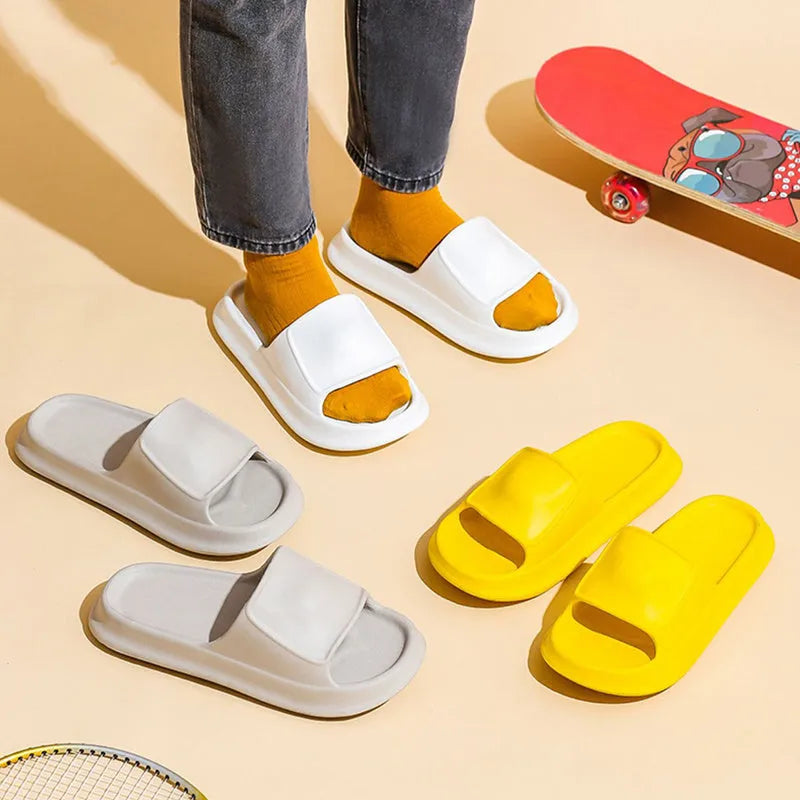 EVA flip-flop slippers with thick sole in multiple colours on a bathroom floor