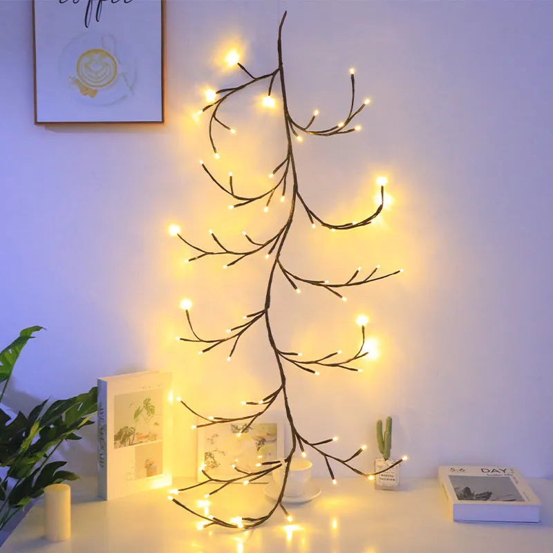 1.8 metre tall flexible rattan tree lamp with colourful LED butterflies, showing bent branches.
