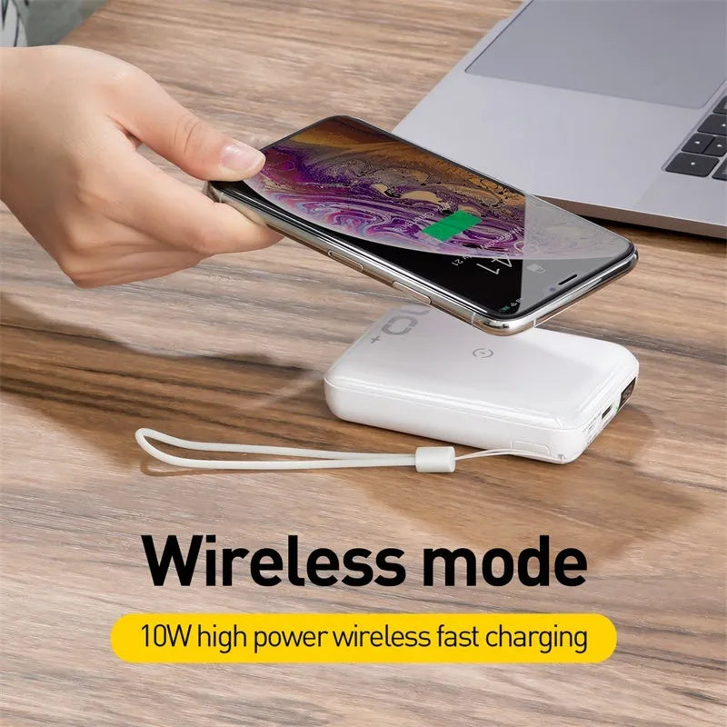 Small square black wireless fast charge power bank with LED digital display showing battery percentage