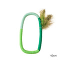 Green cotton rope circular cat toy with feathers and catnip for safe chewing and interactive play