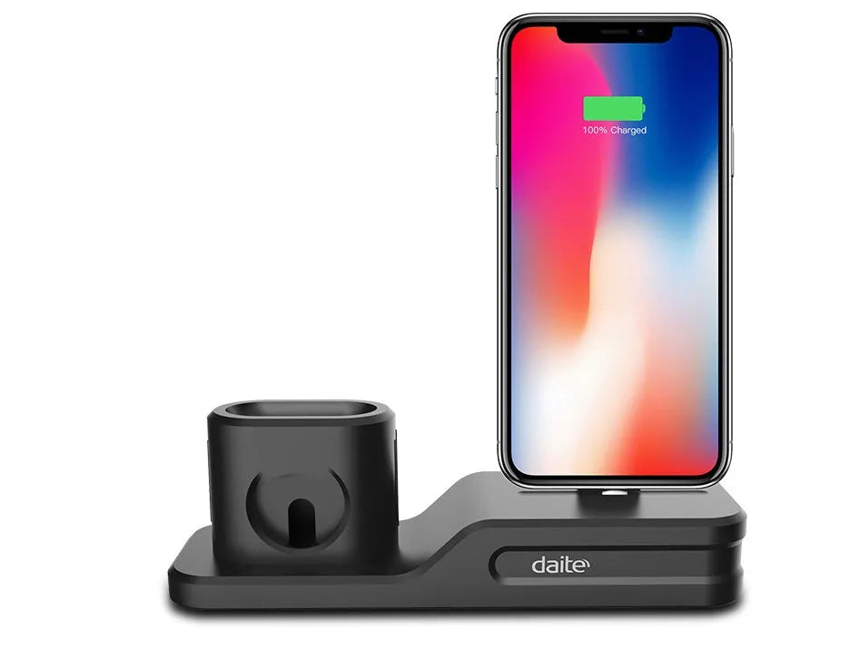 Black silicone 3-in-1 charging stand for iPhone, iWatch, and AirPods on a desk