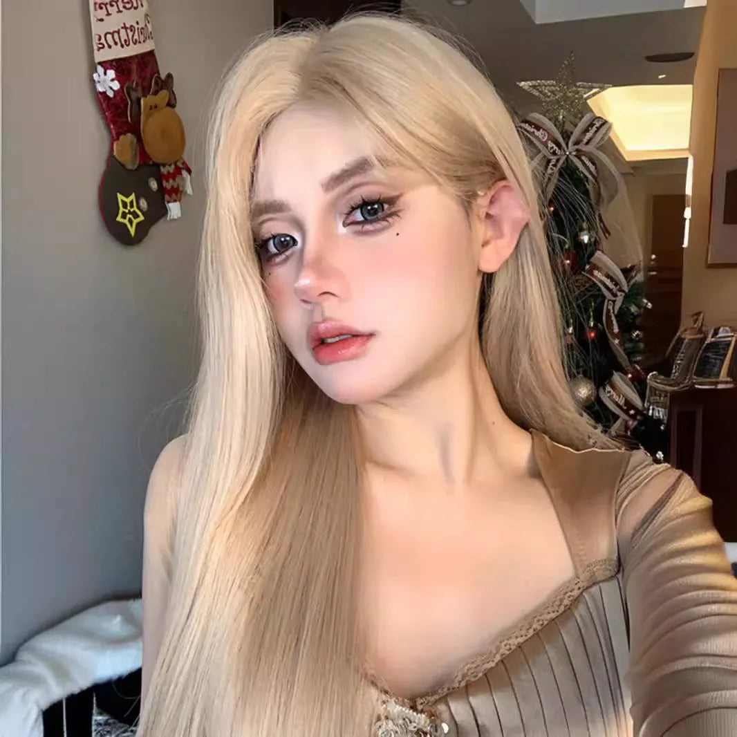 Long straight milk tea blonde synthetic wig on a model, shown with an included hair net.