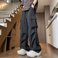 Waterproof loose-fit straight-leg trousers in black, available in plus sizes.