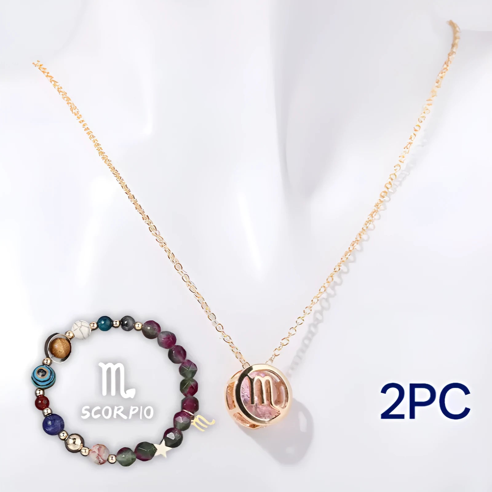Natural stone beaded necklace and bracelet set on a table, showing varied gemstone colours.