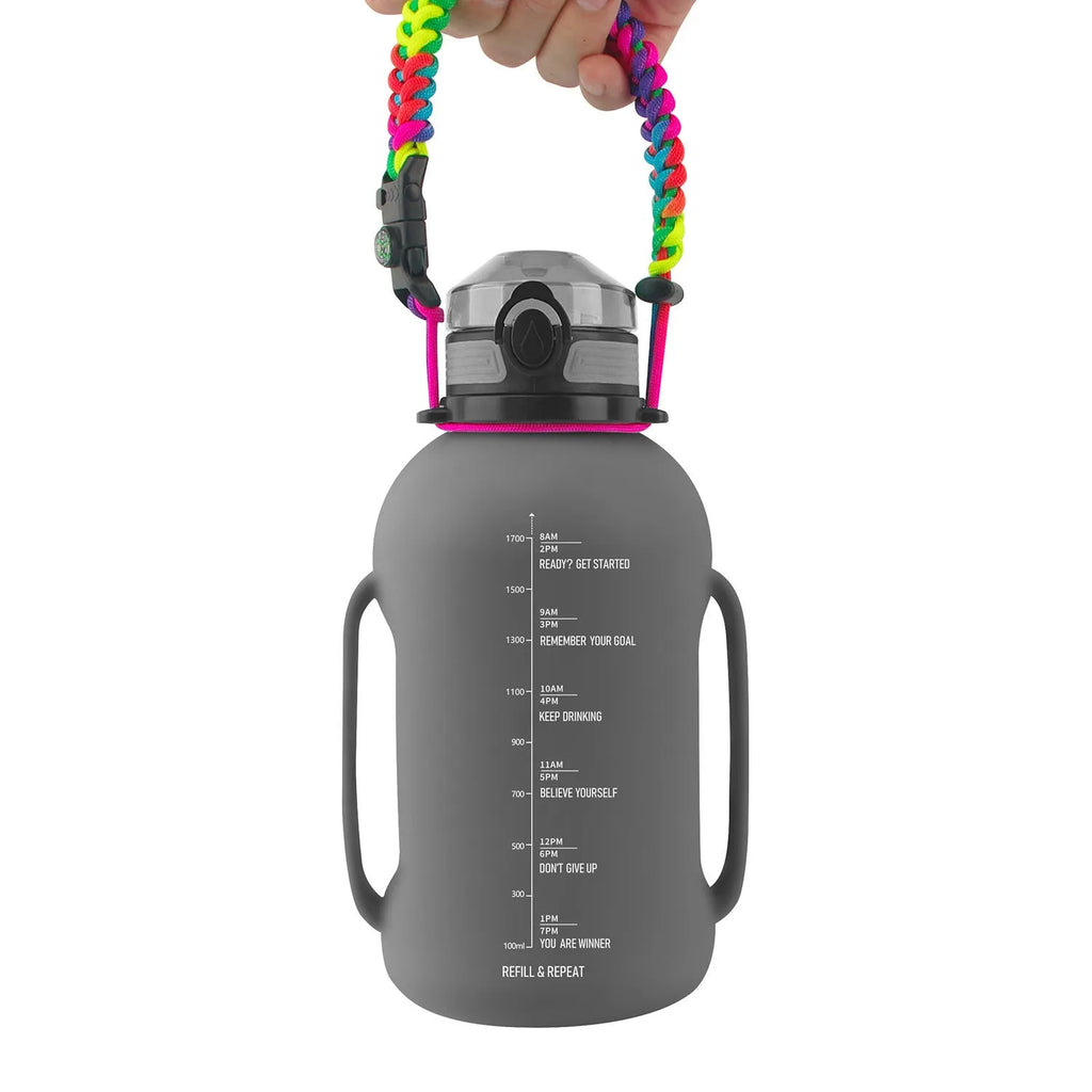 Large black collapsible silicone sports water bottle shown full and folded next to a backpack.