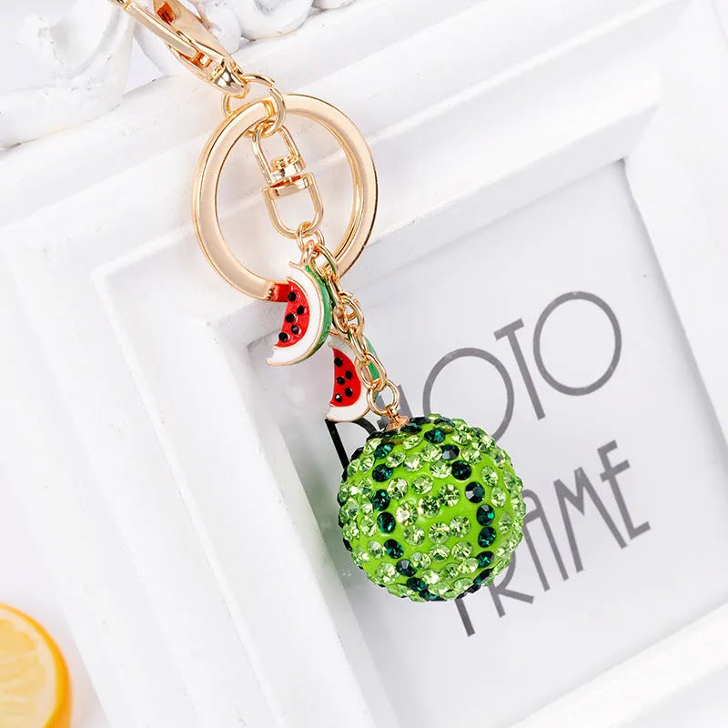 Green watermelon-shaped zinc alloy keychain measuring 12cm with textured surface details