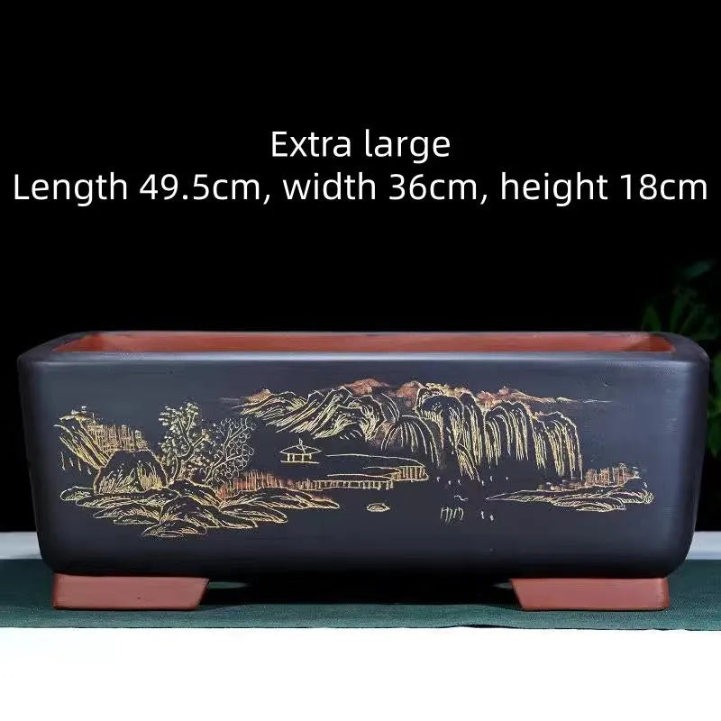 Large rectangular handmade purple clay flower pot in wine red, shown next to a bonsai tree.