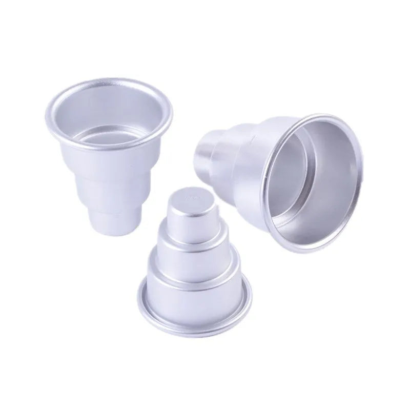 Set of three silver aluminium alloy cake moulds in large, medium, and small sizes.