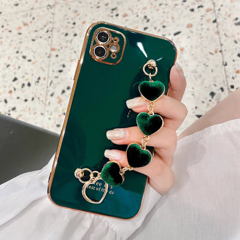 Solid colour silicone mobile phone case with an attached wrist strap for Samsung Galaxy smartphones.