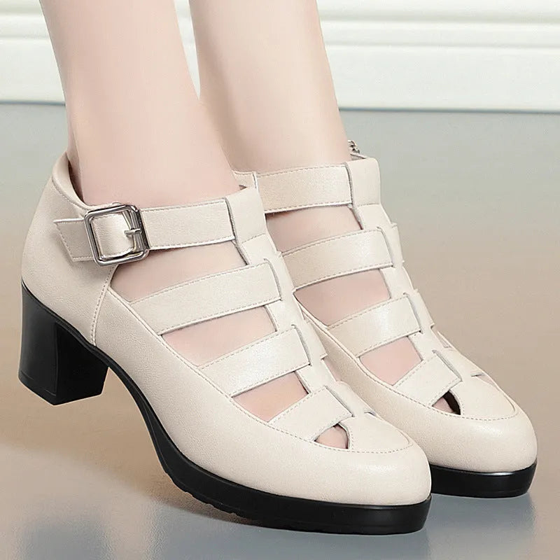 Women's beige closed toe sandals with chunky heel, woven hollowed upper, and ankle strap buckle.