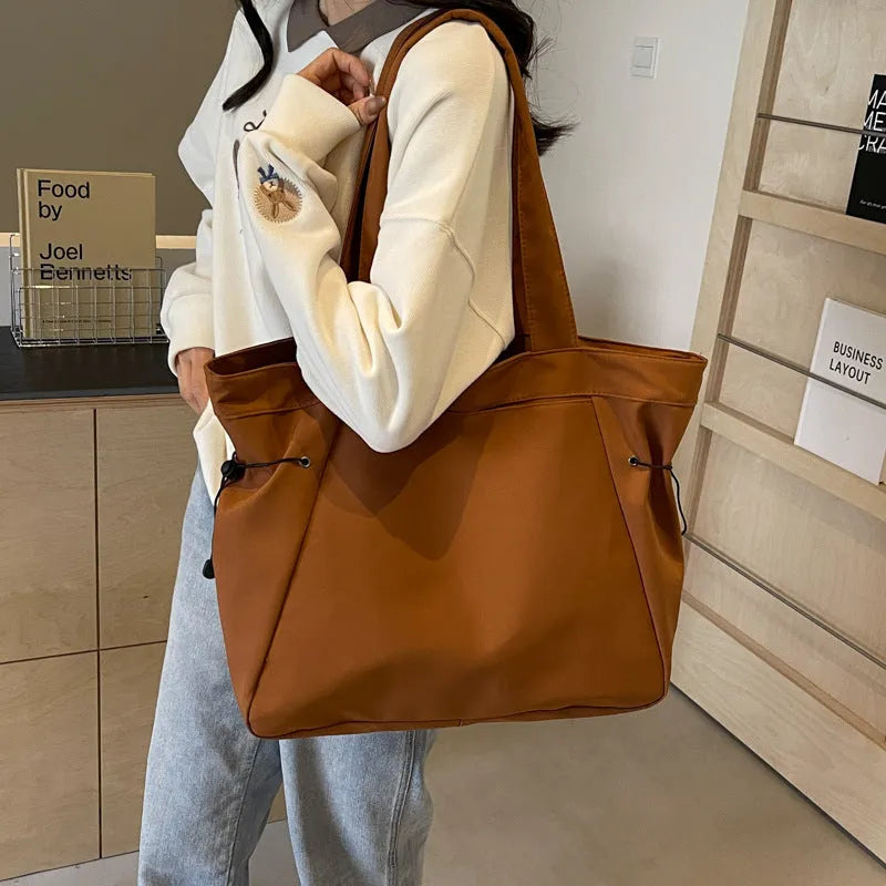 Soft foldable Oxford cloth tote bag in street style, shown in a choice of five colours.