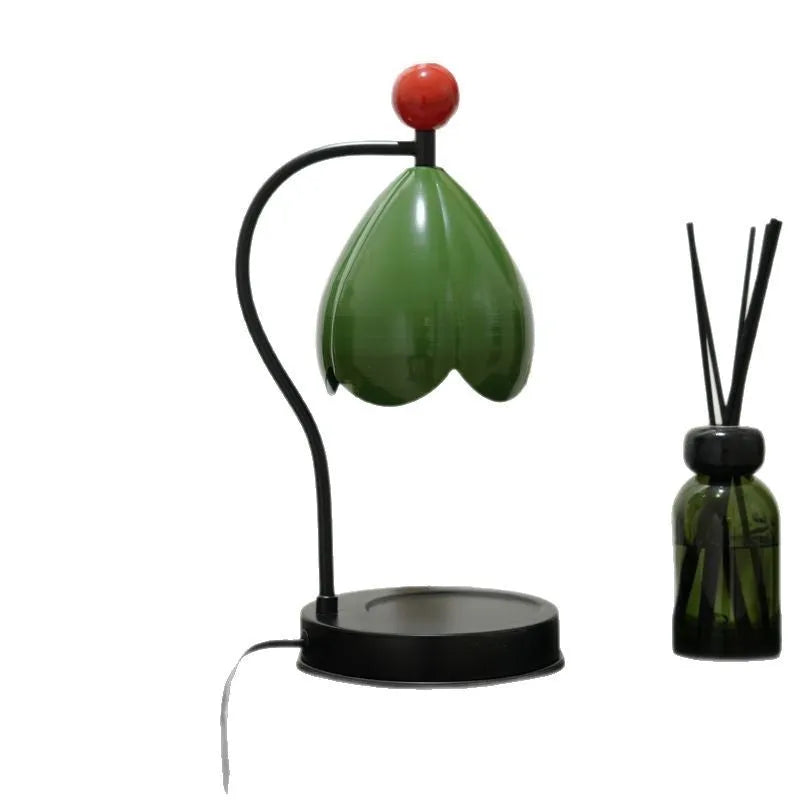 Linglan Melting Wax Lamp in cream white or dark green with metal construction and modern simplicity design