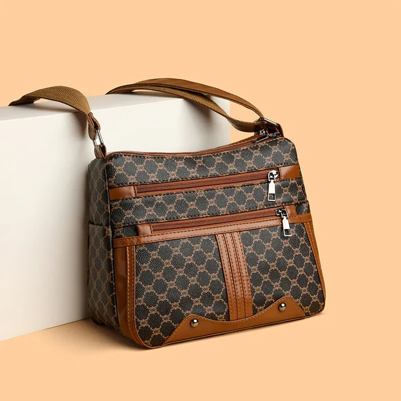 Brown women's crossbody bag with stitching pattern and shoulder strap