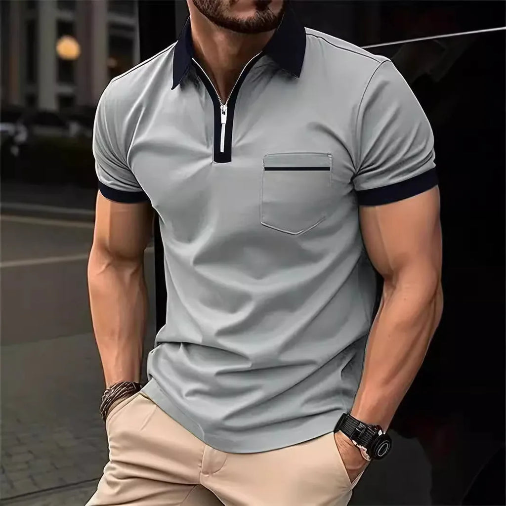 Man wearing a loose-fit short-sleeve casual shirt with a chest pocket and zipper decorations on the front.
