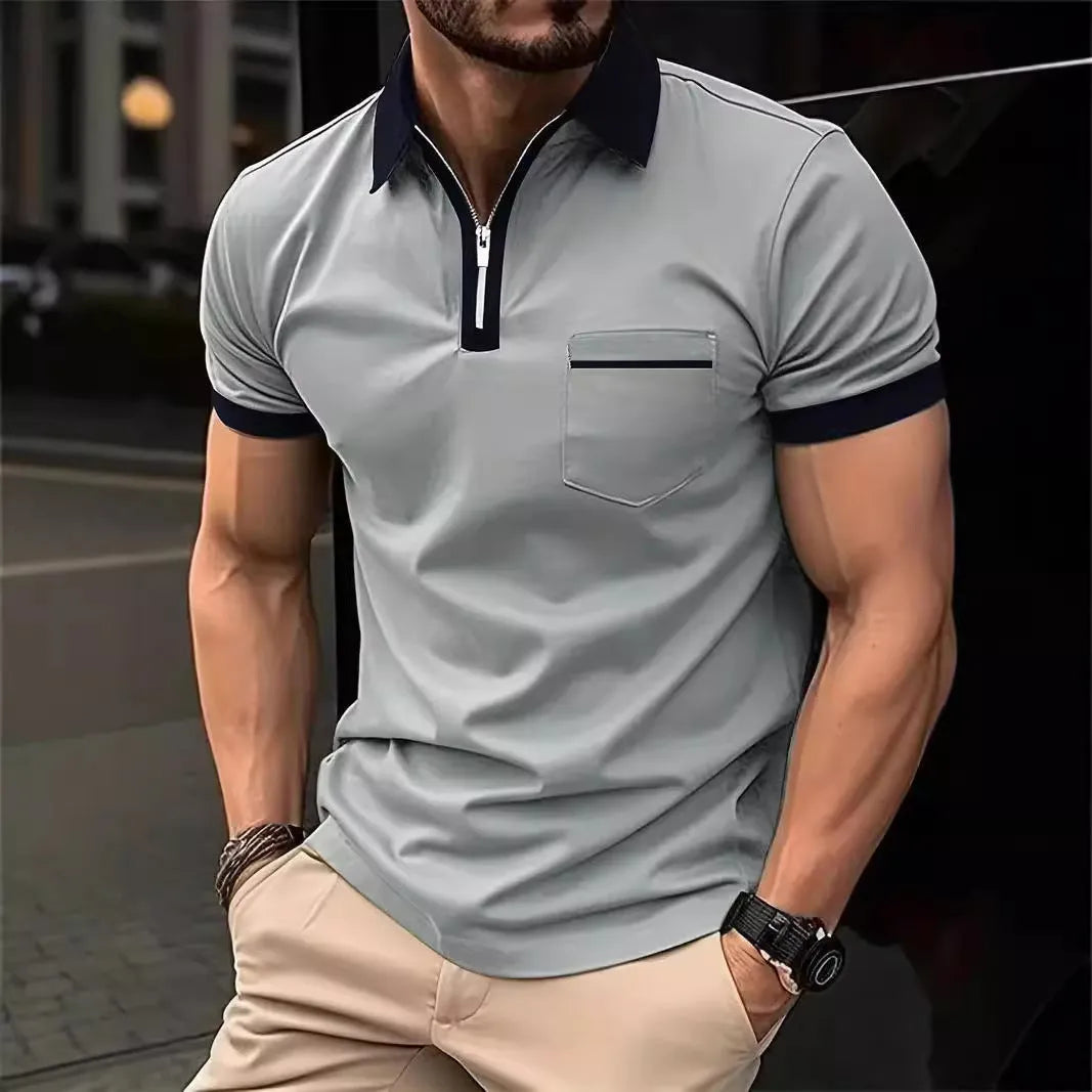 Man wearing a loose-fit short-sleeve casual shirt with a chest pocket and zipper decorations on the front.