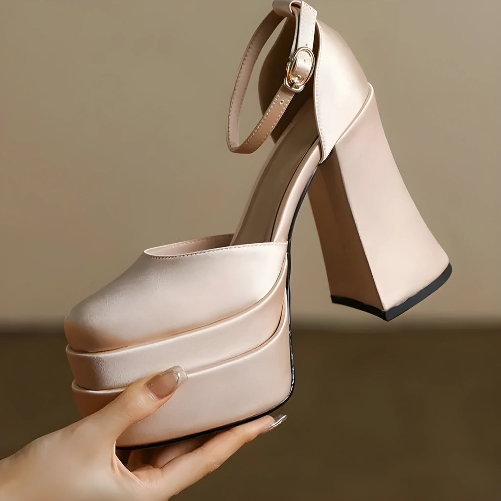 Women's white waterproof platform pumps with a chunky heel and round toe