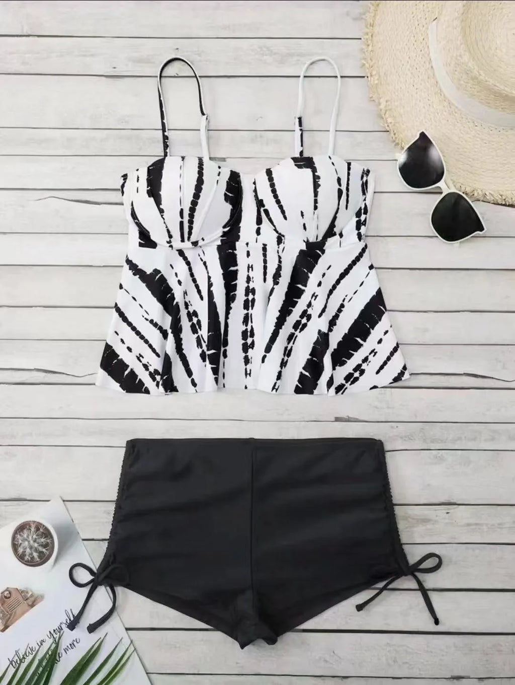 Women's printed bikini swimsuit with hard cups in blue, shown as a top and shorts set.