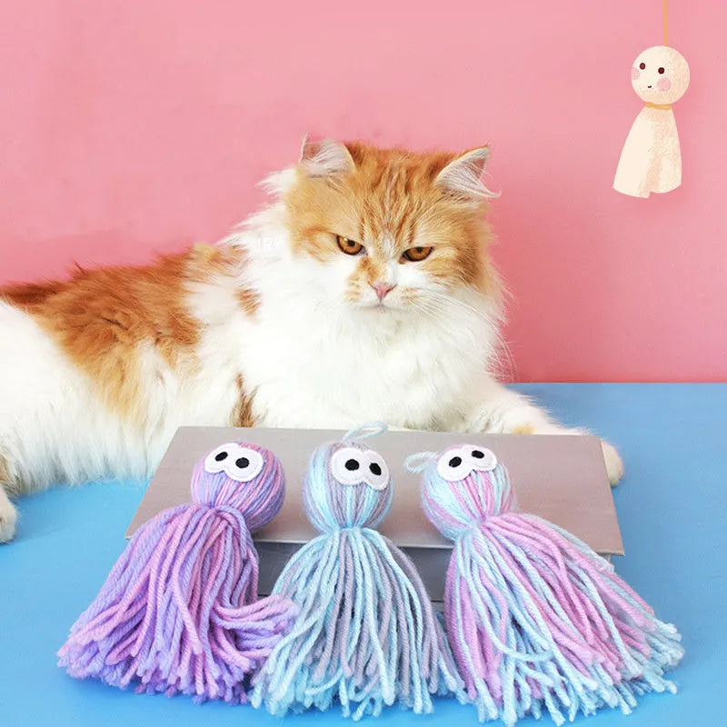 Cat toy wool ball measuring 10x13x4cm with hanging cord and teaser stick attachment in three colour options