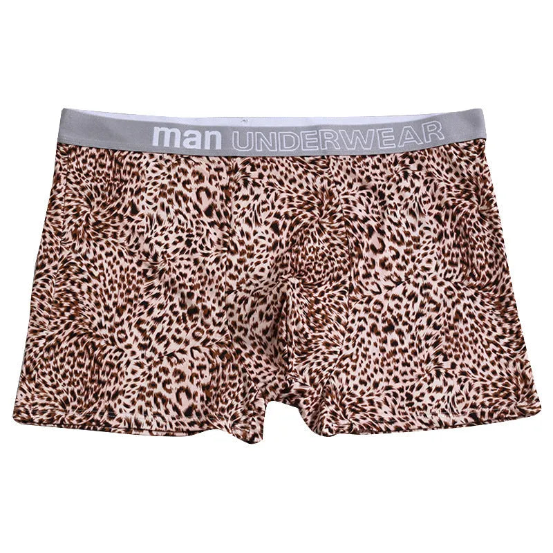 Men's leopard print underwear in milk silk polyester fabric showing loose fit and mid waist design
