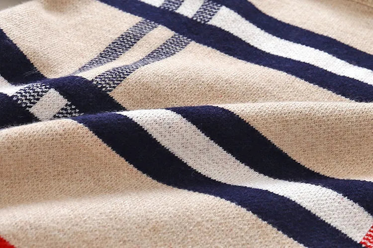 Boy's apricot and navy blue plaid jacquard cotton sweater with long sleeves on a hanger
