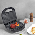Black electric sandwich pan with double-sided heating, brushed stainless steel cover, and 29-31cm non-stick cooking surface