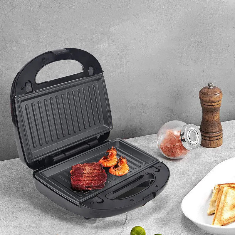 Black electric sandwich pan with double-sided heating, brushed stainless steel cover, and 29-31cm non-stick cooking surface