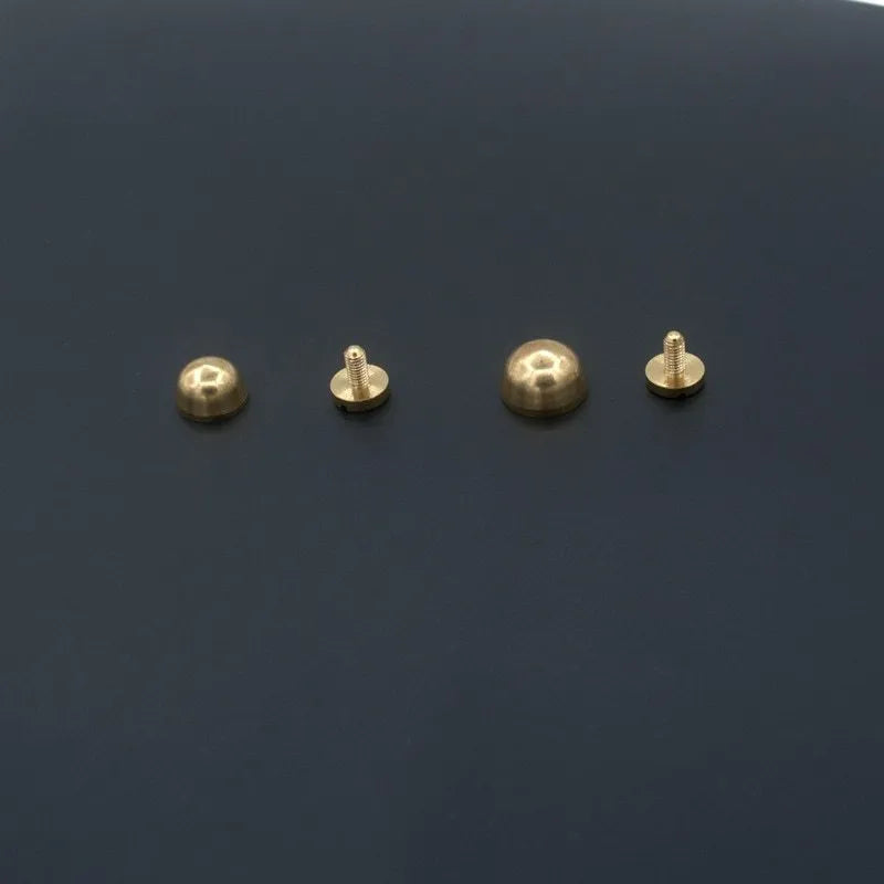 Brass decorative buckle for footwear showing 10x6mm and 12x7mm sizes in round and geometric shapes
