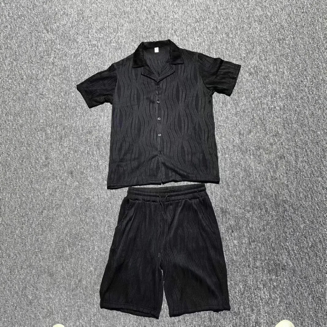 Men's black wave pattern short sleeve shorts suit laid flat showing shirt and matching shorts