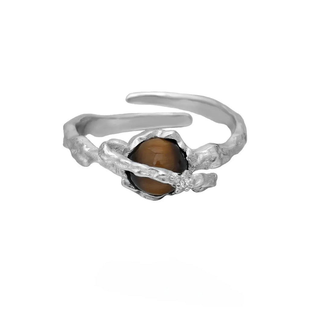 Women's adjustable Saturn open ring in electroplated white gold colour showing original design and adjustable opening mechanism