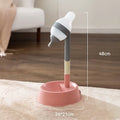 Green adjustable pet water dispenser showing detachable pole, bowl with water-weight holder, and steel ball-tip nozzle