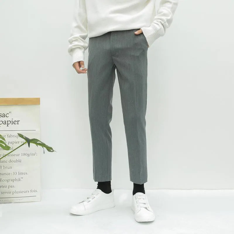 Men's straight-leg cotton trousers with drawstring waist in black, grey or khaki colours.