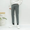 Men's straight-leg cotton trousers with drawstring waist in black, grey or khaki colours.