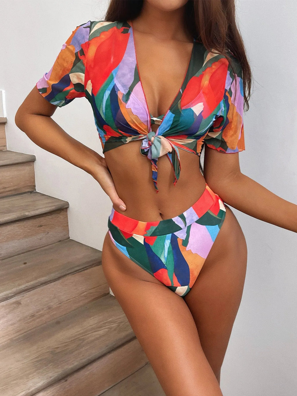 Red women's printed split swimsuit with surf styling and nylon fabric