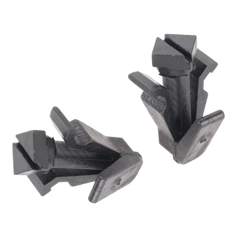 Black plastic automotive fastening clip for Nissan bumper and radiator grille, part number 76882-0M060.