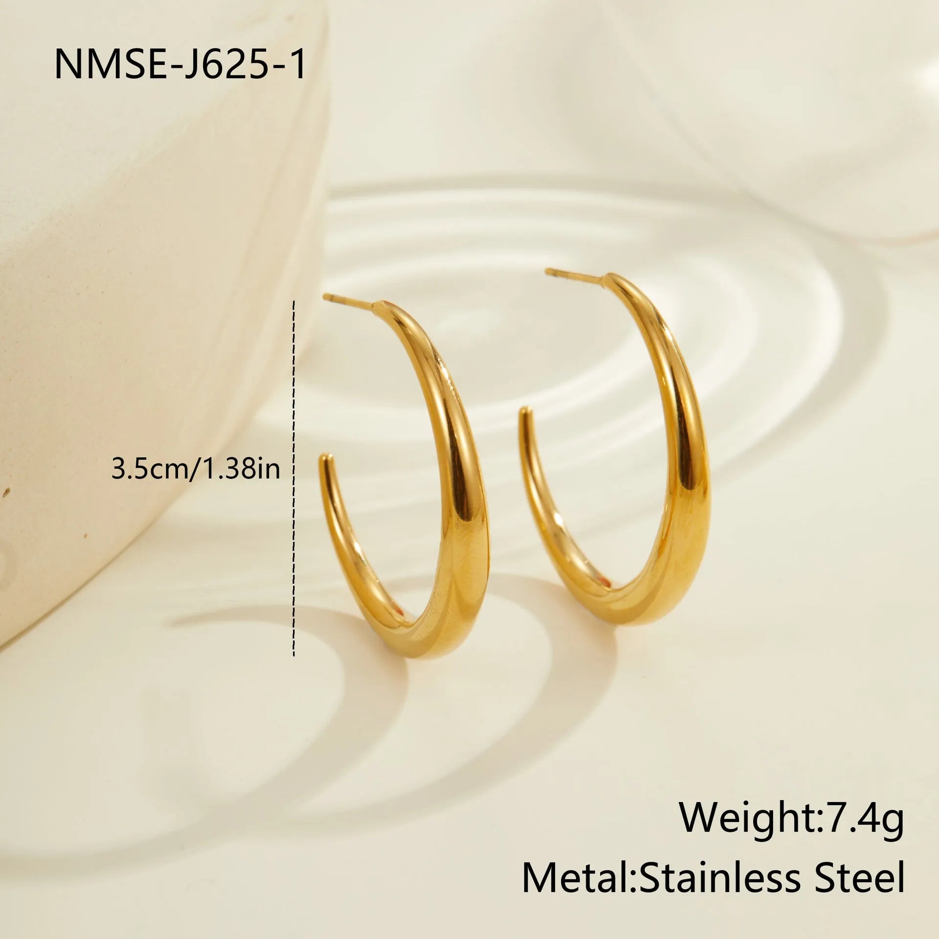 Gold and steel coloured titanium steel hoop earrings for women in large and small sizes.