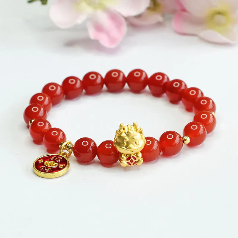 Close-up of a red agate bead dragon zodiac bracelet on a wrist, showing 8mm beads and Chinese style design.