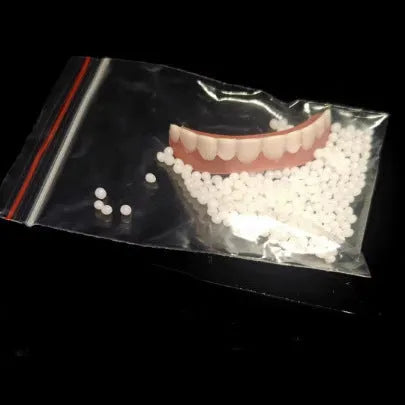 Silicone simulation dentures showing upper and lower teeth in natural colour for dental training