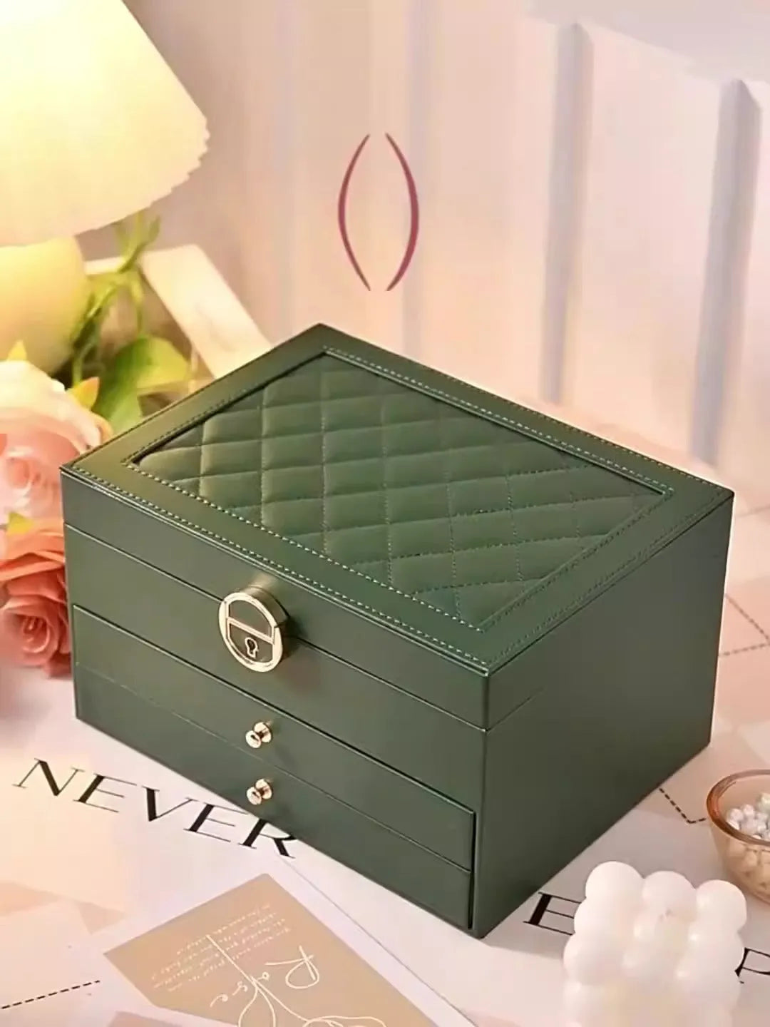 Leather jewellery storage box with three drawers open, showing storage for necklaces, earrings, and bracelets.