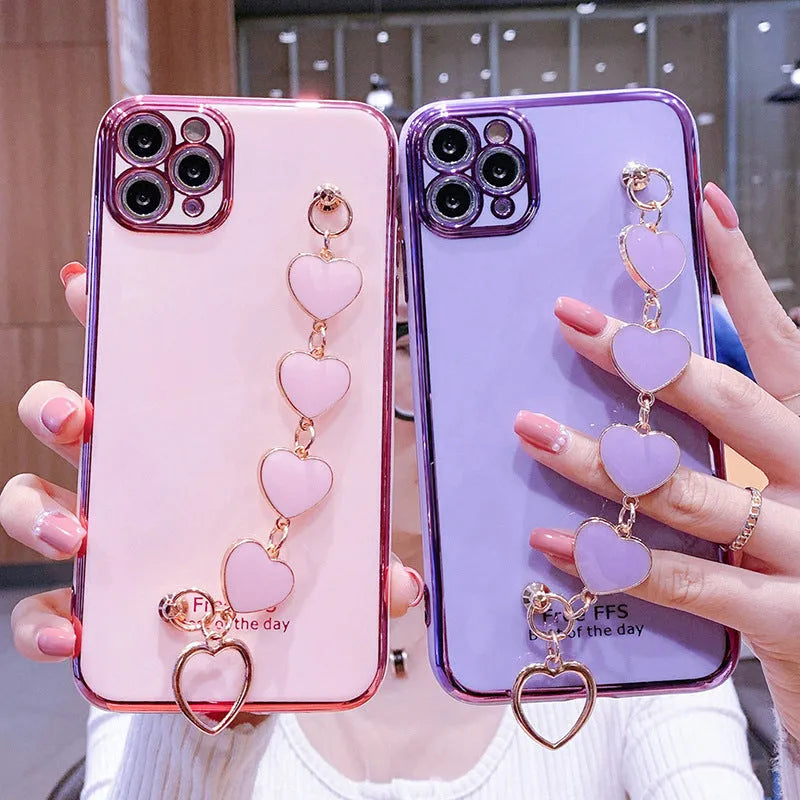 Solid colour silicone mobile phone case with an attached wrist strap for Samsung Galaxy smartphones.