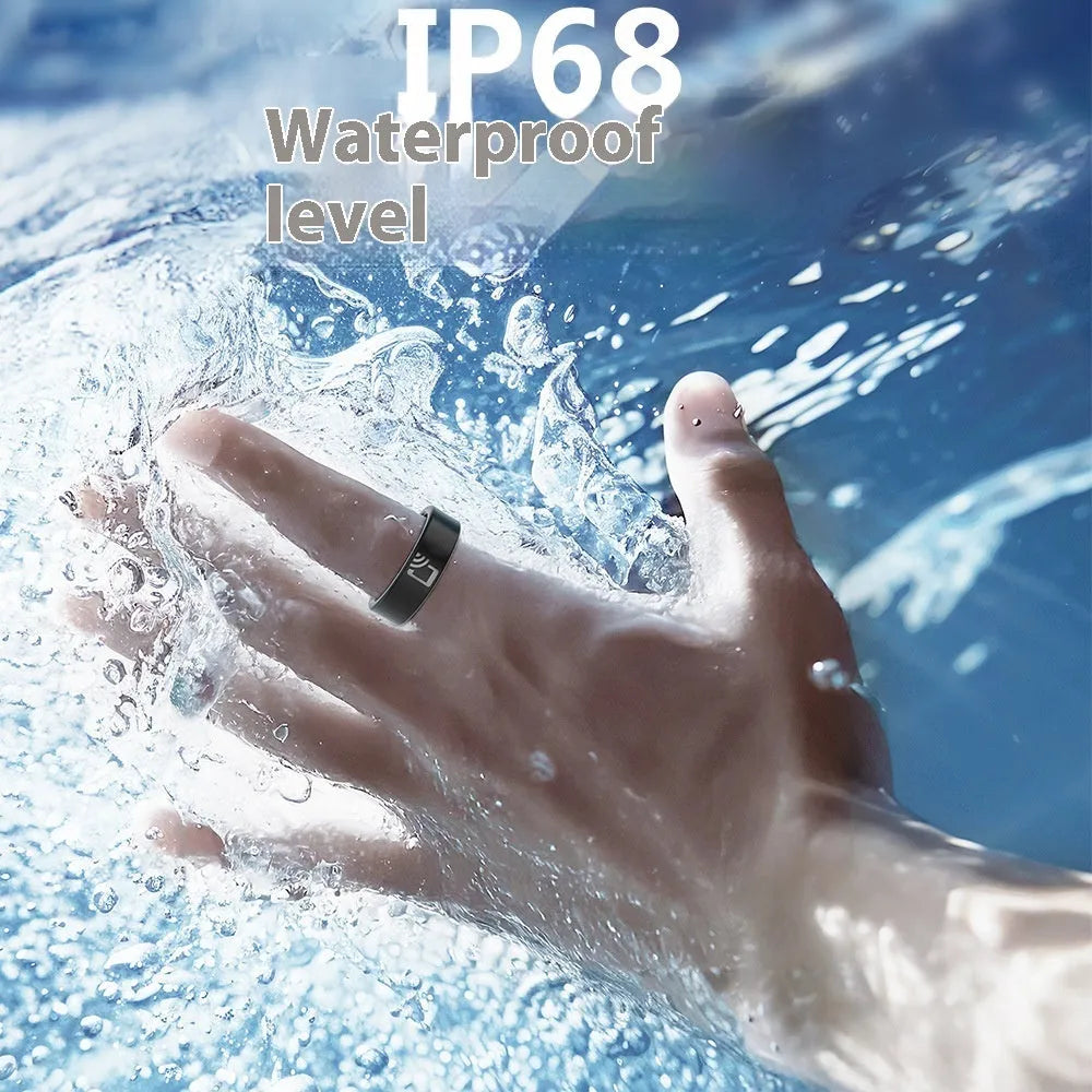 Black ceramic smart ring on finger showing health monitoring display with heart rate and blood oxygen readings