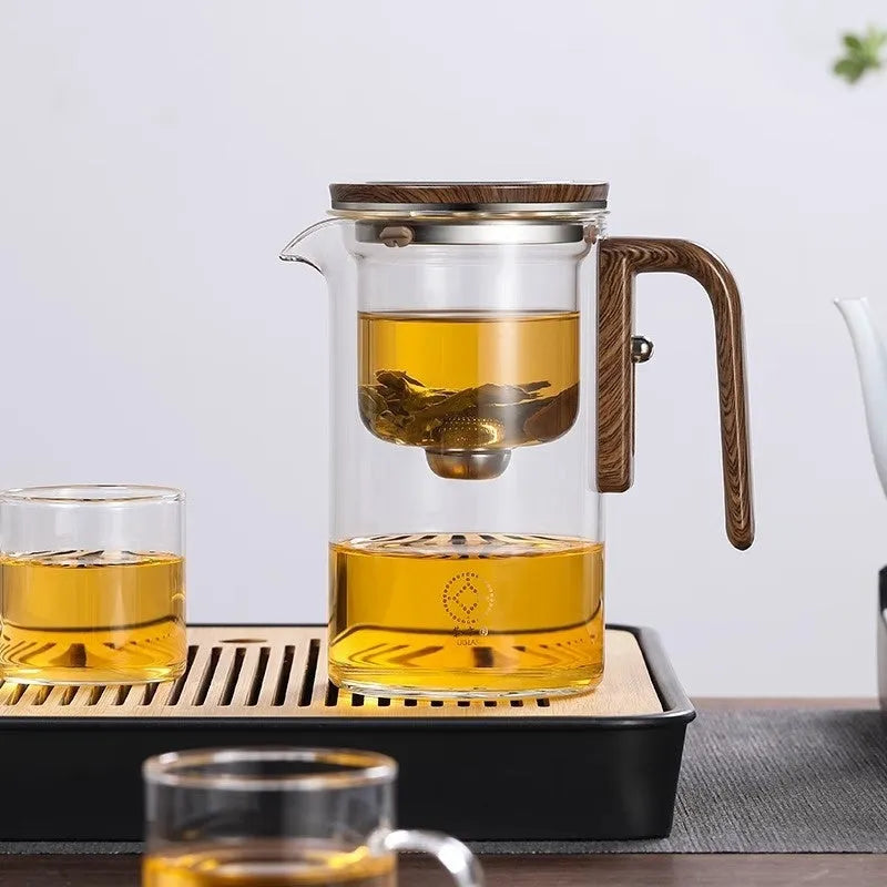 Glass teapot with wooden handle showing magnetic tea separation system and Chinese style design