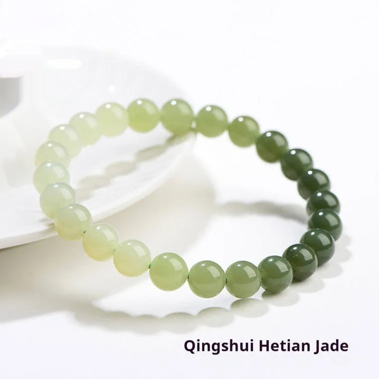 Natural gradient water Hetian jade bracelet with choice of round or barrel beads.