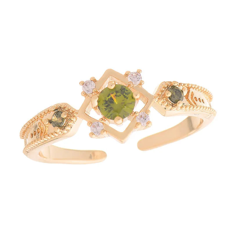 Geometric copper open mouth ring with purple zircon stones in round settings