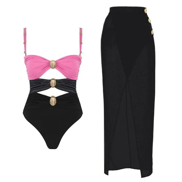 Women's green one-piece swimsuit with round buckle decoration and hollow-out stitching detail on front.